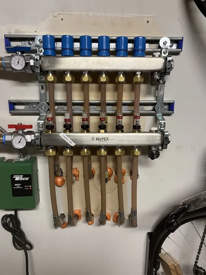 Plumber performing Water Heater Repair at a residential property in Leeds